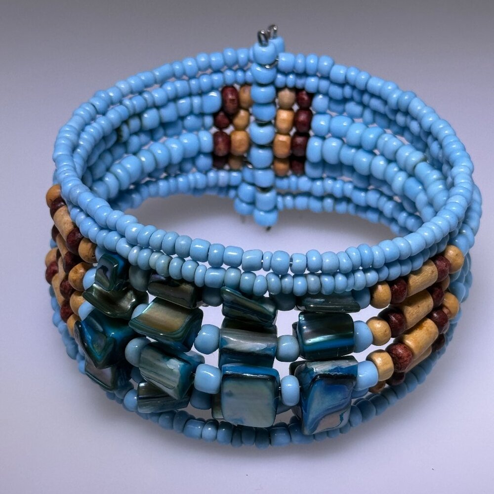 Turquoise color beaded memory wire cuff with shell, wood beads